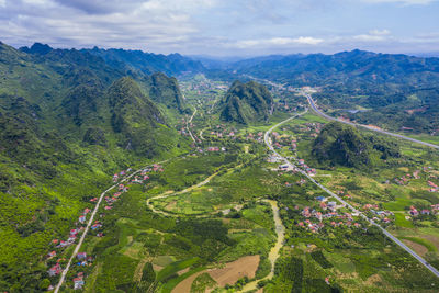 High angle view of trees and mountains against sky