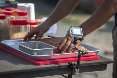 Mid section of a man preparing food