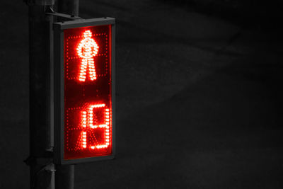 Close-up of illuminated road sign