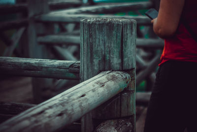 Midsection of man standing by railing