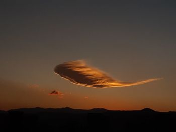 Low angle view of silhouette landscape against sky during sunset