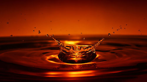 Close-up of water splashing in glass