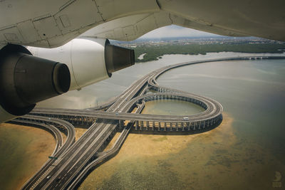 Airplane engine with bridge in background
