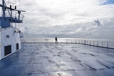 Person by sea against sky