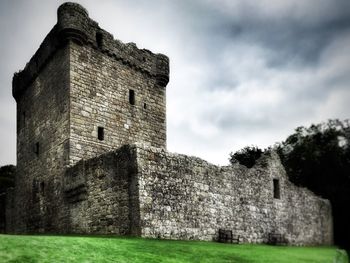 Old ruin building against cloudy sky