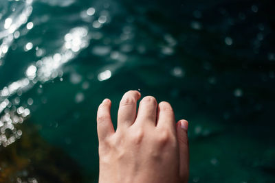 Close-up of human feet in water