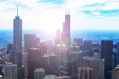 Aerial view of modern buildings in city against sky