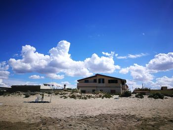 View of beach against blue sky