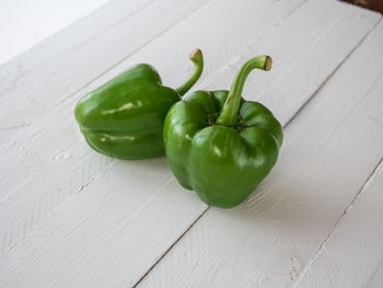 High angle view of green chili peppers on table