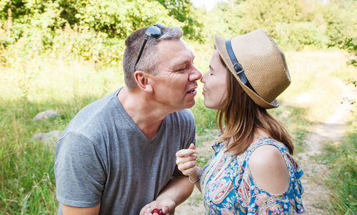 Couple kissing in park