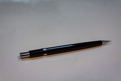 High angle view of pen on table against white background