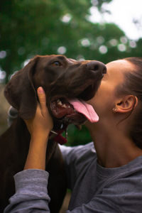 Close-up of woman with dog
