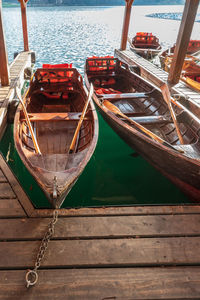 High angle view of sailboats moored on pier