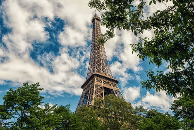 Low angle view of tower against cloudy sky