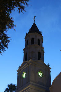 Low angle view of clock tower against sky