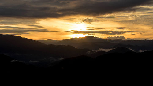 Scenic view of mountains at sunset