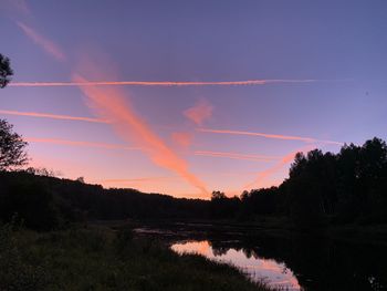 Scenic view of silhouette landscape against sky at sunset