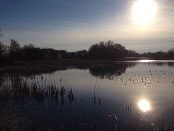 Scenic view of lake at sunset