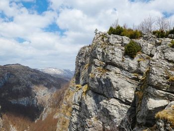 Low angle view of rock formation against sky