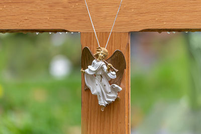 Close-up of heart shape on wooden post