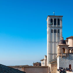 Low angle view of historic building against clear blue sky