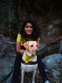 Portrait of young woman with dog