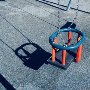 Old swing on the playground, childhood moments