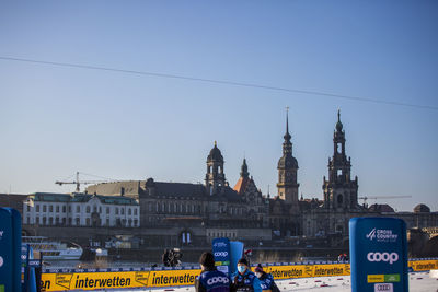 View of city buildings against clear sky