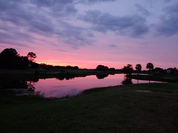 Scenic view of lake against sky during sunset