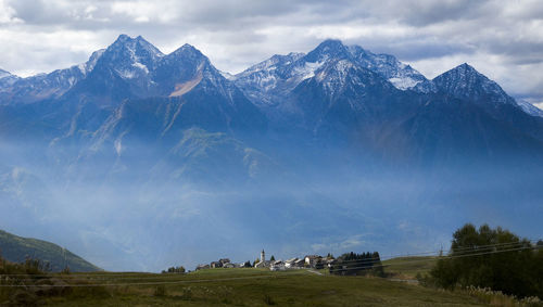 Scenic view of snowcapped mountains against sky