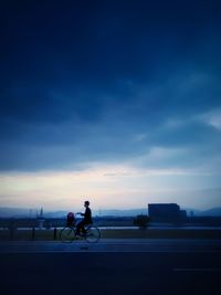 People riding bicycle on road