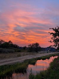 Scenic view of lake against sky during sunset