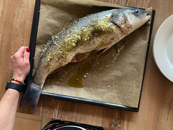 High angle view of person preparing food on table