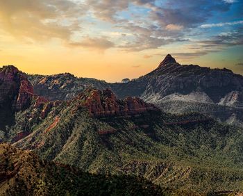 Scenic view of mountain range against sky during sunset