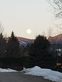 Scenic view of snow covered mountains against clear sky