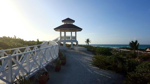 Gazebo by sea against clear sky