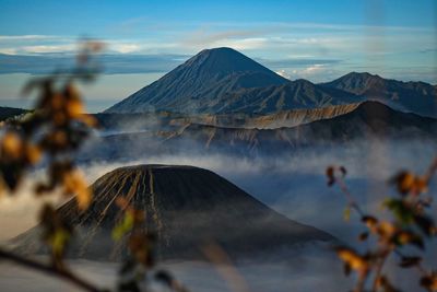 Close-up of volcanic mountain range against sky