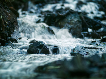 Close-up of water flowing over rocks
