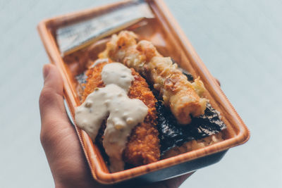 Close-up of hand holding food