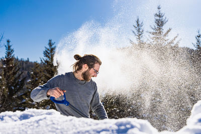 Full length of young man in snow