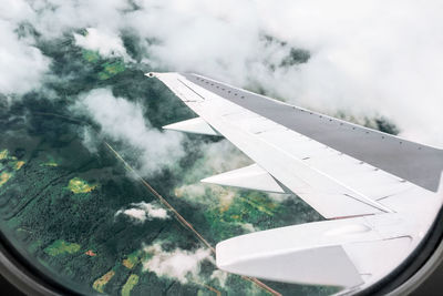 Aircraft wing seen through airplane window