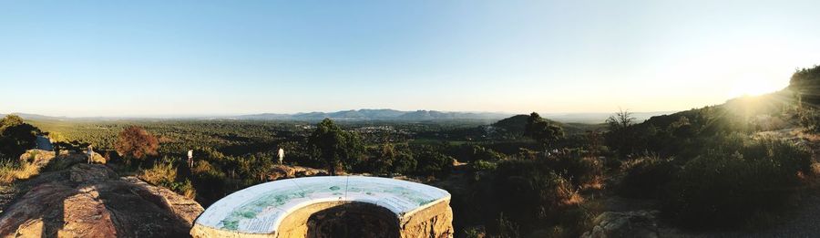 Scenic view of mountains against clear blue sky