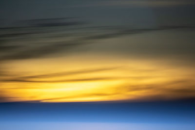 Low angle view of cloudy sky at sunset
