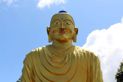 Low angle view of statue against sky