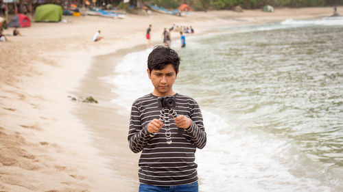 Man photographing at beach