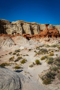 Scenic view of rocky mountains against clear blue sky