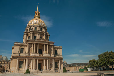 Front facade of les invalides palace with the golden dome in paris. the famous capital of france.