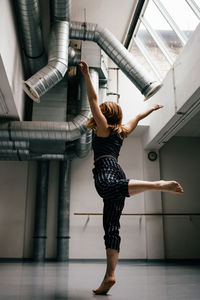 Young woman standing indoors