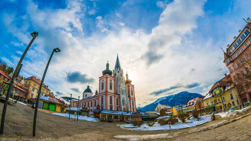 Low angle view of buildings against sky in city