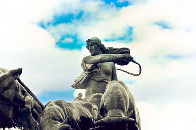 Low angle view of statue against sky